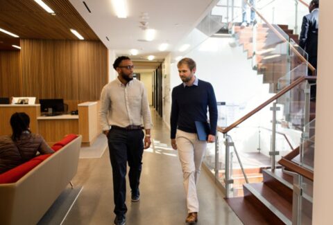 Two engineers walking and talking about security