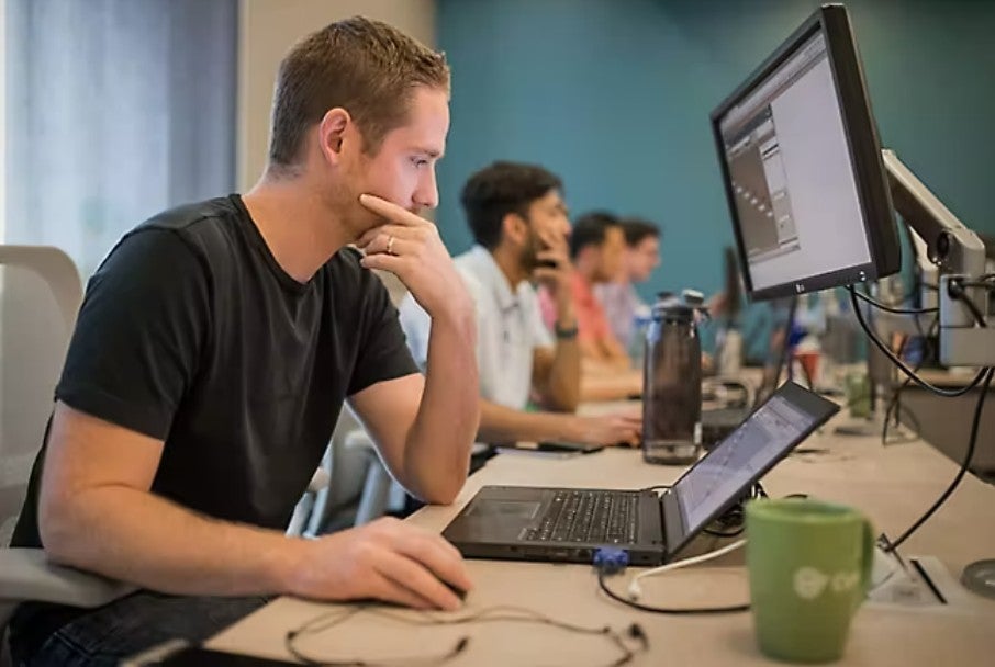IT staff looking at monitors